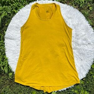 Athleta Essence Vital Tie Back Tank Top in Mustard Yellow Size Medium